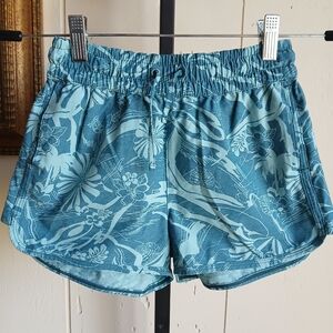 ATHLETA GIRL DIVE IN SHORTS SIZE M (8-10)